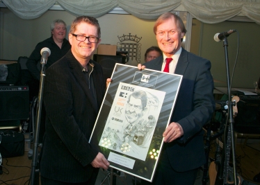 Sir David presenting Kevin Brennan MP his cartoon